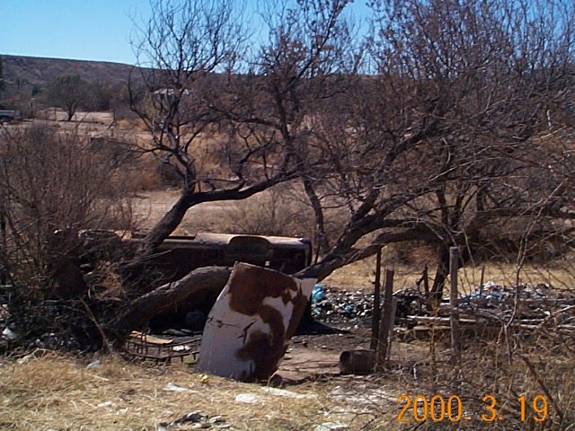 [Trashed car & trash]